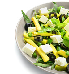 Plate with tasty avocado salad on white background