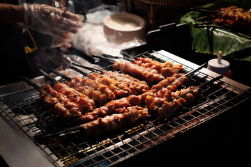 Chicken skewers were grilled on an electronic stove