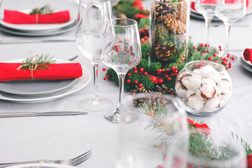 Beautiful table setting for Christmas dinner on light background