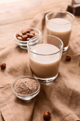 Glasses of protein shake on table