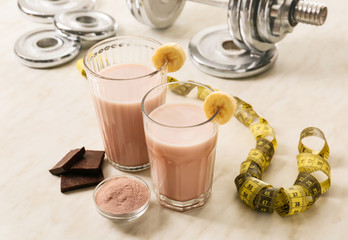 Glasses of protein shake on table