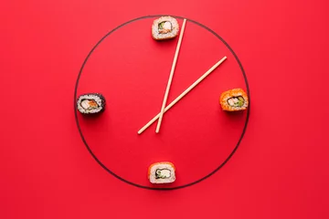 Zelfklevend Fotobehang Creative clock made of tasty sushi and chopsticks on color background © Pixel-Shot