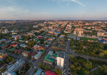 Obraz premium Aerial view of Tomsk city, Frunze Avenue, stadium. Russia. Summer, evening, sunset