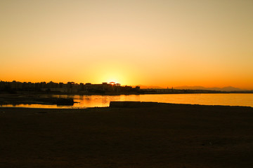 Beautiful bright yellow sunset over the tropical sea.