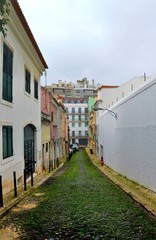 Fototapeta na wymiar Narrow street in the Lisbon city Portugal 30.Oct.2019 It is famous for its beautiful labyrinthine streets