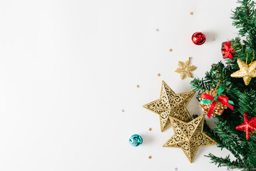 Top view of Christmas decorations and gift boxes on white background.