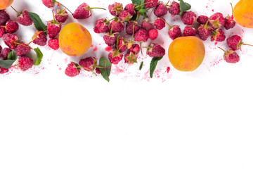 Fresh organic raspberries and apricot. Fruit background with copy space. Summer fruits and berries harvest concept. Vegan, vegetarian, raw food. Banner