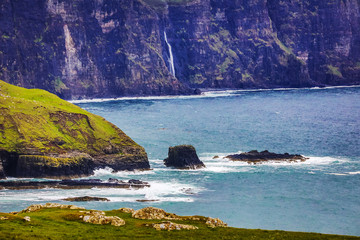 Waves breaking on coastal cliffs of Scotland.