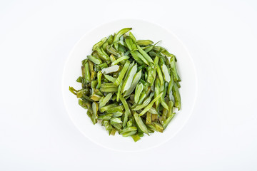 Freshly cut sea cabbage on a saucer on a white background