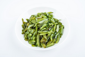 Freshly cut sea cabbage on a saucer on a white background