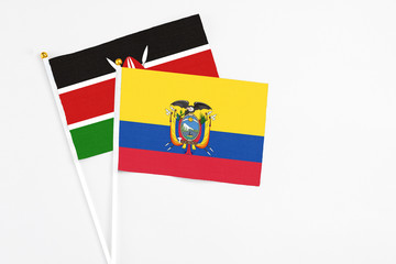 Ecuador and Kenya stick flags on white background. High quality fabric, miniature national flag. Peaceful global concept.White floor for copy space.