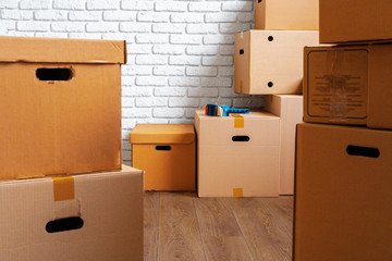 Close up of moving carton boxes in an empty room