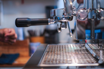 Fototapeta na wymiar Close-up of barista preparing coffee in a coffee shop