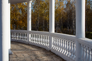 Antique style gazebo. White gazebo. Parkland.