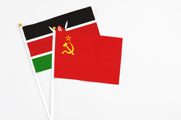 Soviet Union and Kenya stick flags on white background. High quality fabric, miniature national flag. Peaceful global concept.White floor for copy space.
