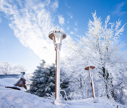 Winter scenery- lantern, clinker and cottage