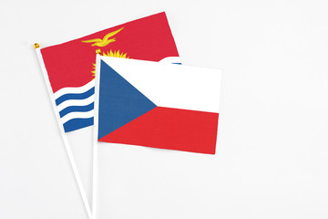Czech Republic and Kiribati stick flags on white background. High quality fabric, miniature national flag. Peaceful global concept.White floor for copy space.