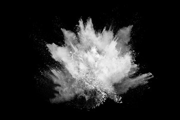 White powder explosion on black background. Colored cloud. Colorful dust explode. Paint Holi.