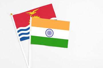 India and Kiribati stick flags on white background. High quality fabric, miniature national flag. Peaceful global concept.White floor for copy space.