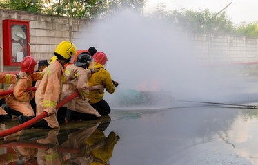 Firefighters practicing firefighting. To prevent a fire accident. A fire will cause a huge loss of property and money. Regular training will create expertise. If there is a fire in the future.