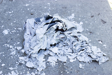 burning paper on the ground, polluted ecology
