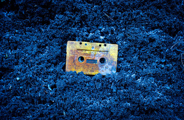 Cassette on dirt background