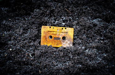 Cassette tape in dirt