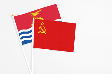 Soviet Union and Kiribati stick flags on white background. High quality fabric, miniature national flag. Peaceful global concept.White floor for copy space.