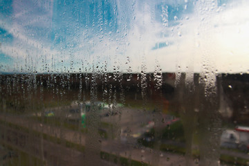 Raindrops on the clear glass window. Water drops. Rain Abstract background texture. Road view