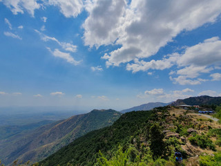 Fototapeta na wymiar mountains of Himalayas in India beautiful midday sunny view with pretty clouds