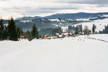Skiers rest in the Ukrainian Carpathian village in winter.