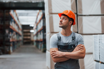 Portrait of young worker in unifrorm that is in warehouse