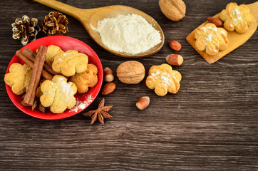 Composition with tasty homemade Christmas cookies on a plate on wooden table