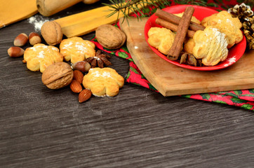 Composition with tasty homemade Christmas cookies on a plate on wooden table