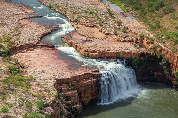 Aerial landscape view of the unnamed waterfall on the DeLancourt River in the remote Kimberley Region of Western Australia in the Wet Season.