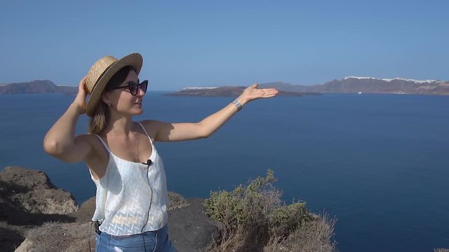 Vloger talks about traveling from a height on a mountain with sea views
