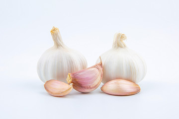 Head and clove garlic isolated on a white background.