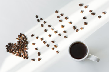 Composition of coffee beans in the form of a heart and mug
