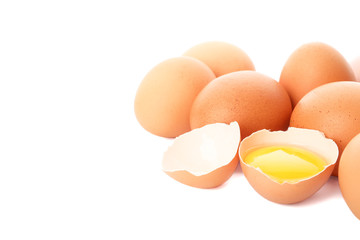 Chicken eggs and half yolk isolated on white background