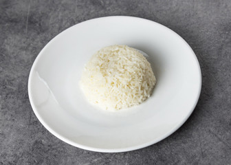 Fototapeta na wymiar Cooked rice on a white plate, Jasmine rice