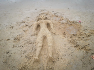 Sculpture in the sand of Porto de Galinhas under the intense sun. High brightness.