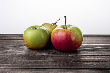Green apples on a wooden background, apples slices
