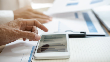 Fototapeta premium Business team brainstorming and discussing with financial data and report graph. Teamwork meeting working concept.