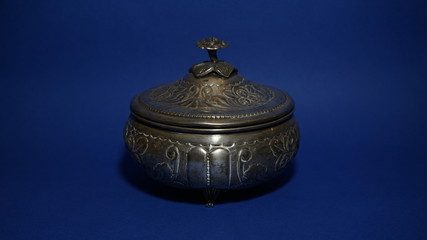 An old silver sweet dishes on blue background