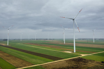 Drone photo of wind turbines on a field in Lodz Province, Poland