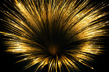 Gilded iridescent led threads radiating in all directions and forming a funnel on a black background