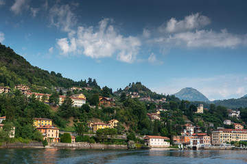 Fototapeta na wymiar Como lake coasts in hot summer morning, Lombardy, Italy.