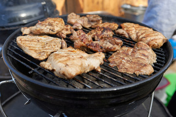 Classic barbecue, pieces of meat on the grill