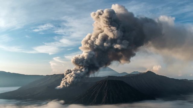 Becoming of Bromo Volcano eruption at sunset, Java Island, Indonesia
