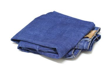 Folded blue jean isolated on white background.